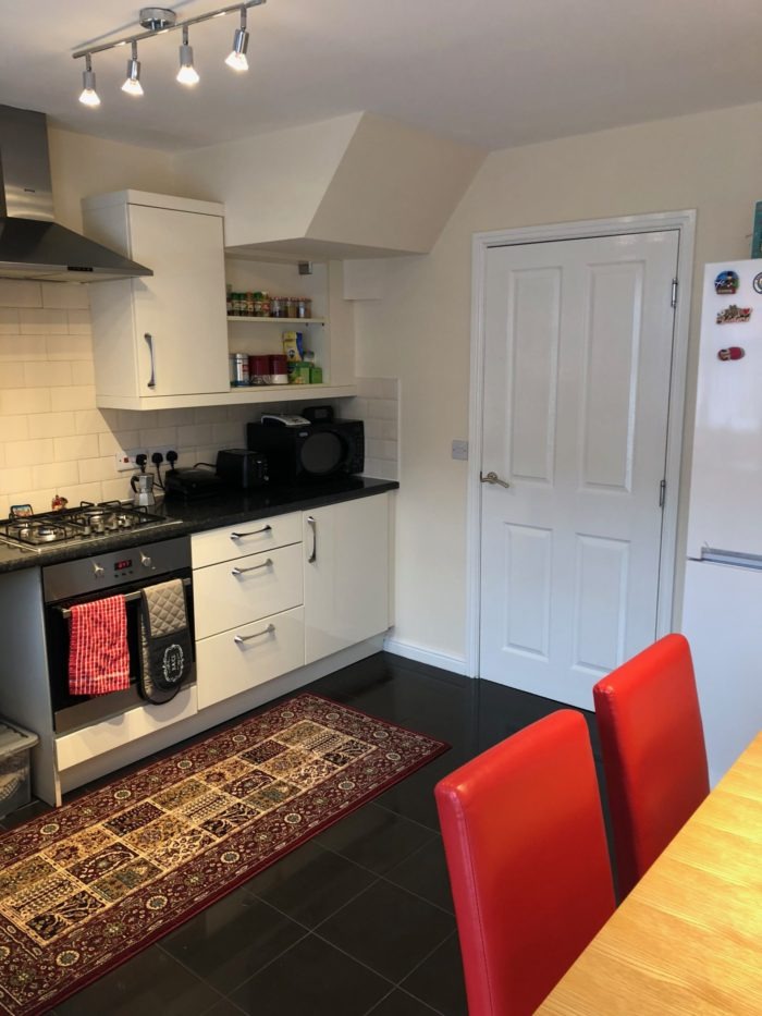 Kitchen and red chairs on dining table