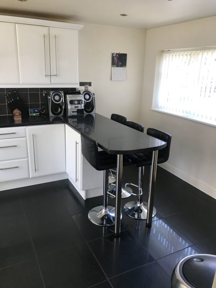 Kitchen and bar stools / eating area in a home stay hosts accommodation