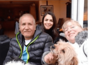 Female student and host mother and host father with their friendly dog picture